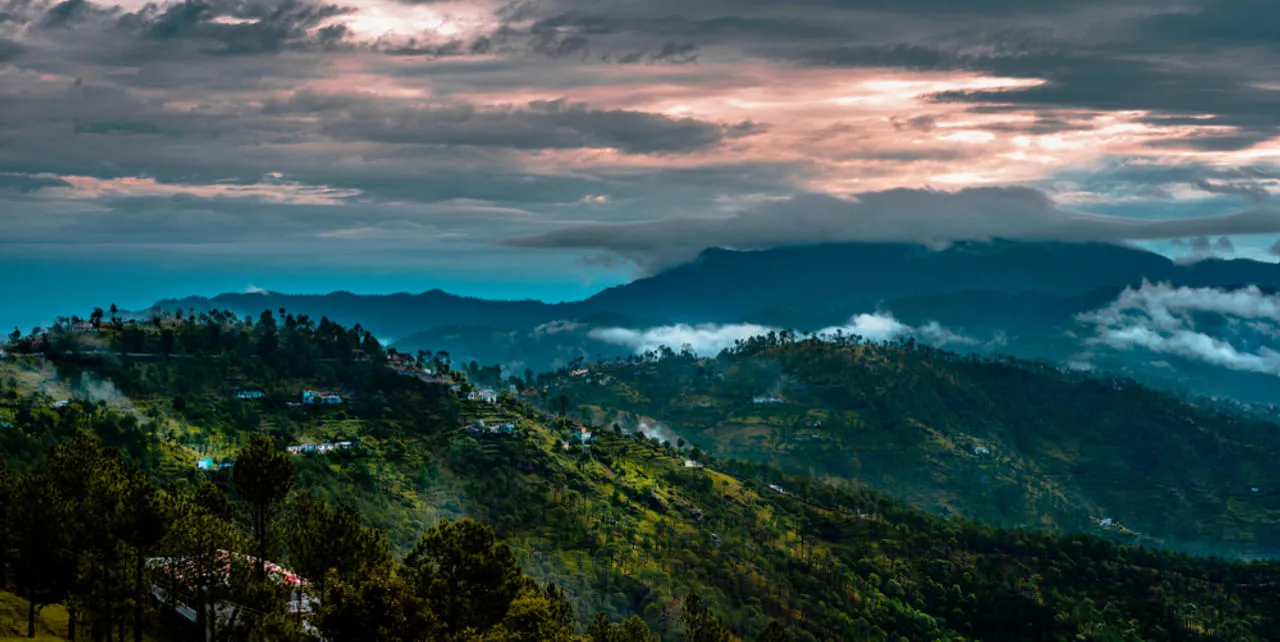 Cloud-draped ridges and scattered hamlets around Almora at dusk