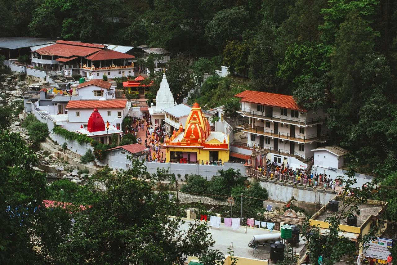 The colourful Kainchi Dham ashram temples beside the Kosi river near Nainital