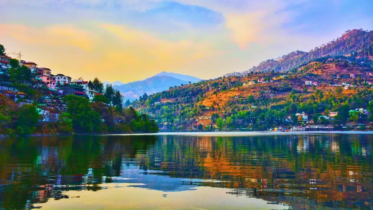 Naini lake at the heart of Nainital, ringed by forested hills at dusk