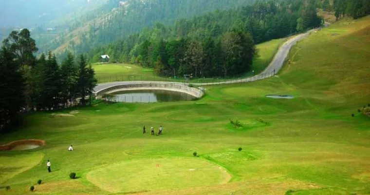 The green Upat golf course among pine ridges at Ranikhet