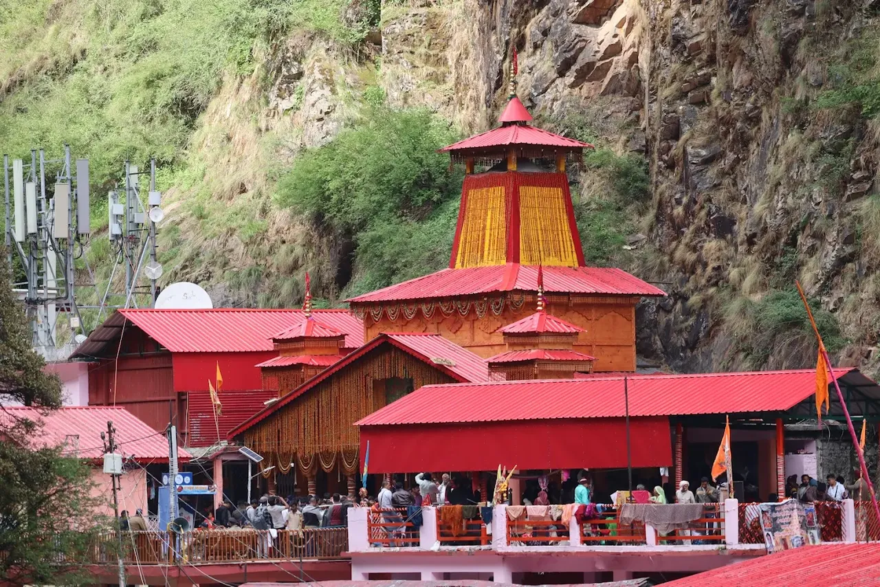 The red-roofed Yamunotri temple in a steep Garhwal river gorge